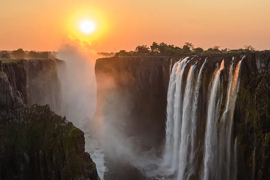 A sunset over Victoria Falls.